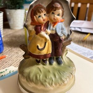 circa 1970 Wind up rotating music figurines